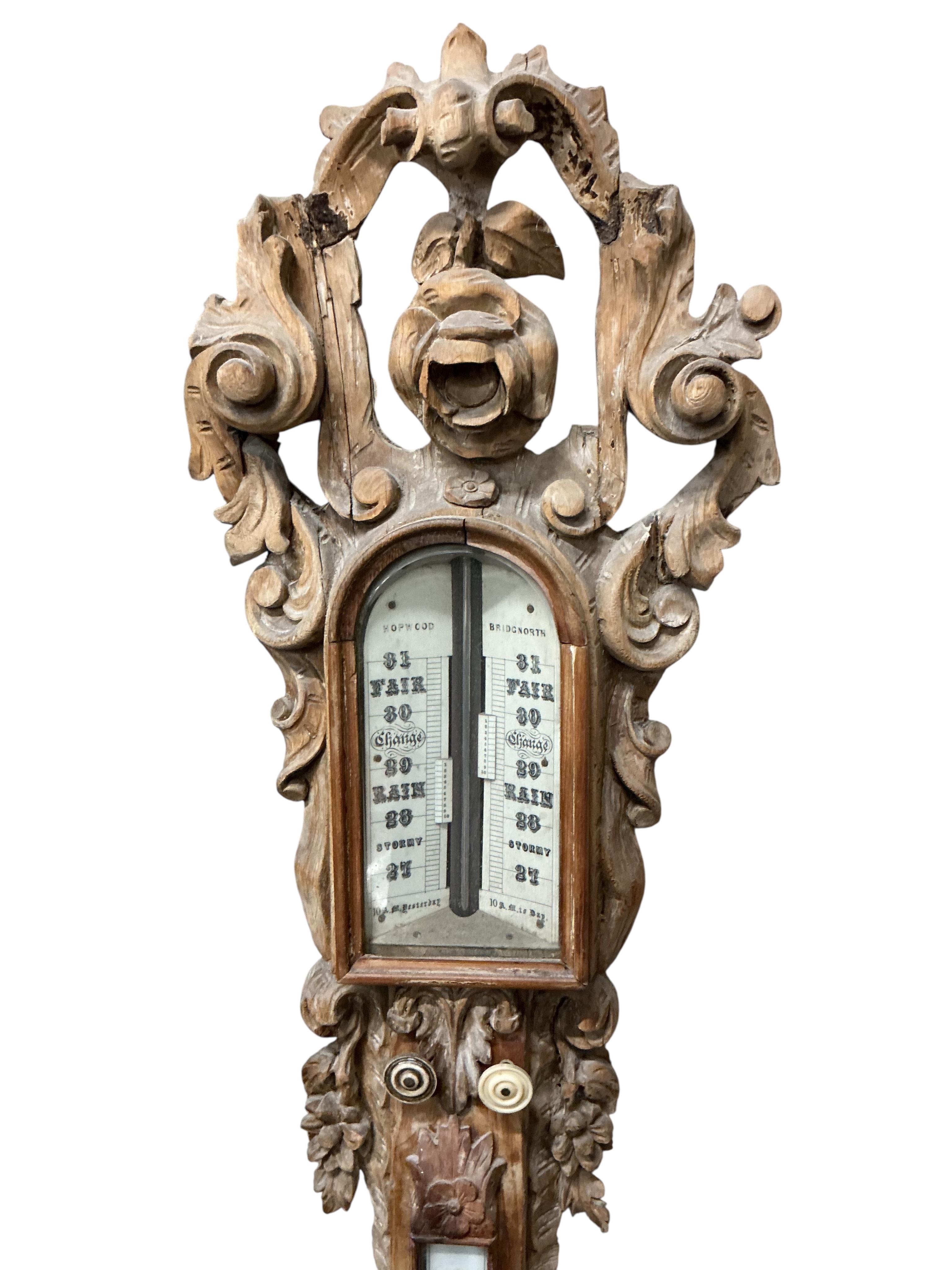 A Victorian elaborately carved pine stick barometer / thermometer by Hepwood of Bridgnorth, height 126cm